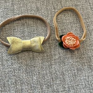 Gold bow and peach flower baby headbands. Set of two